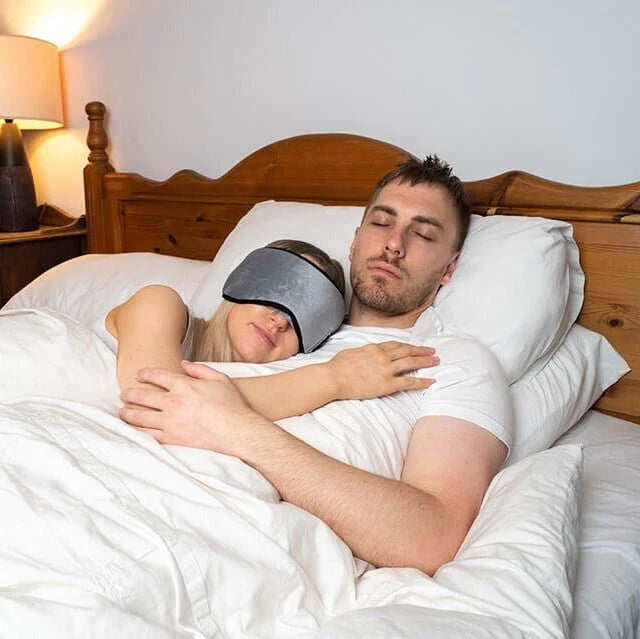 couple asleep wearing sleep headphones