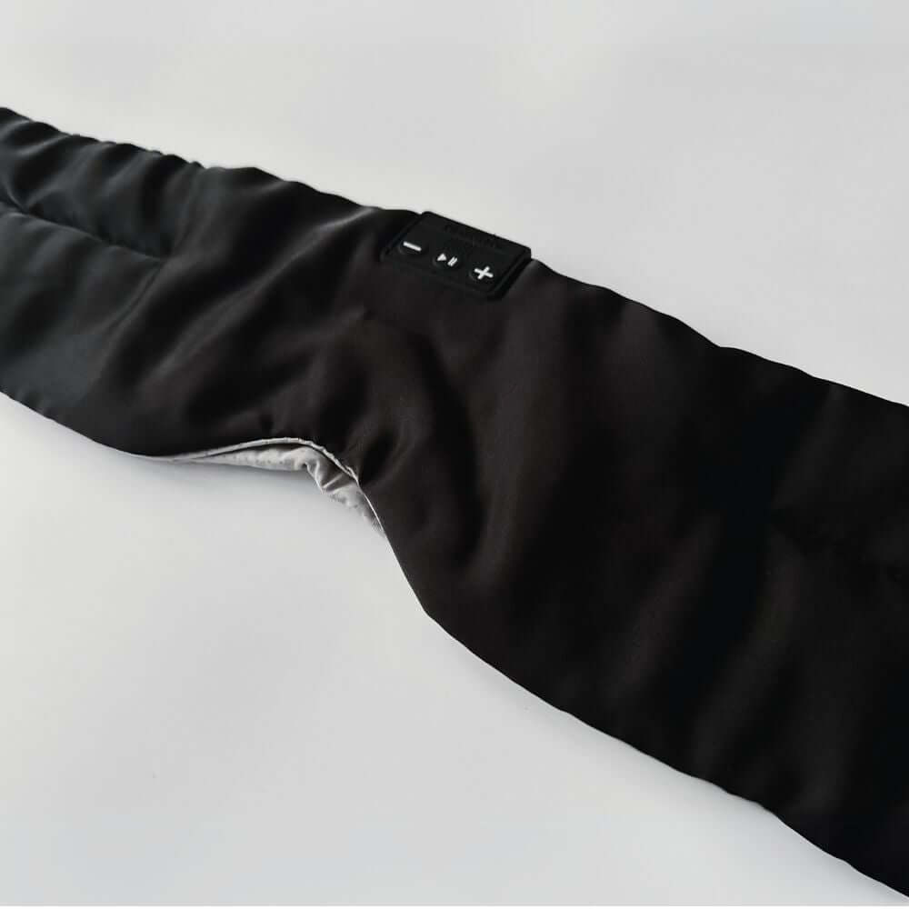 Blacksleep mask with sleep dreams logo showing the silky satin material of the sleep mask