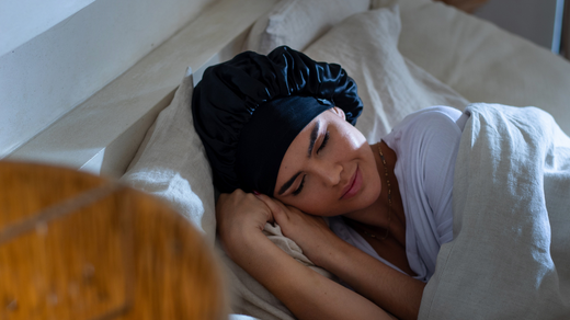 women asleep wearing silk hair bonnet ready to take care and clean it and store it