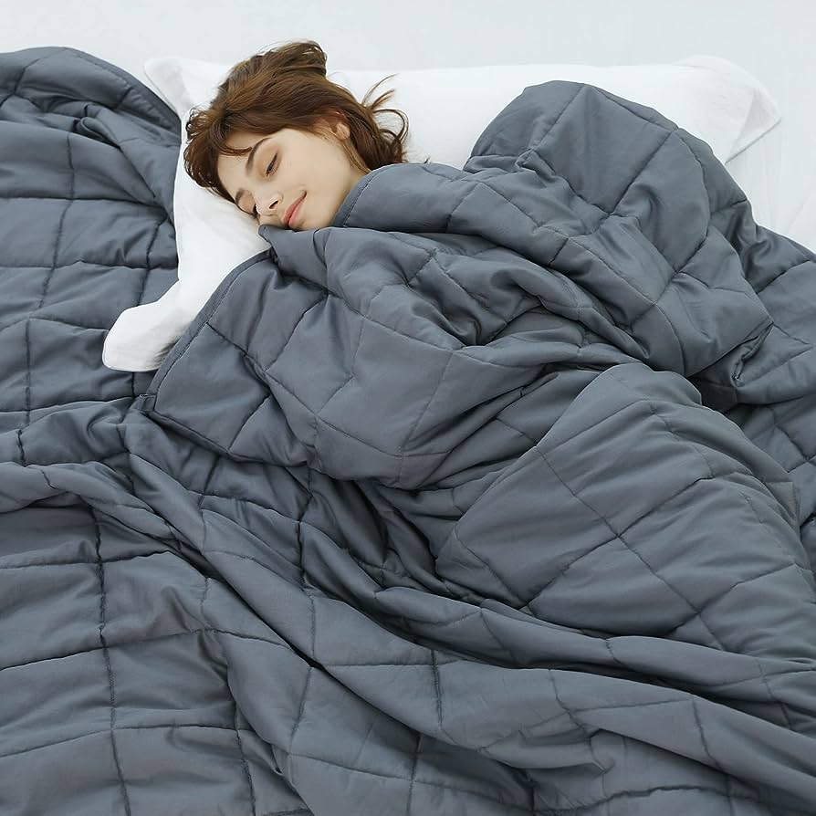 Women sleeping with a grey weighted blanket in australia